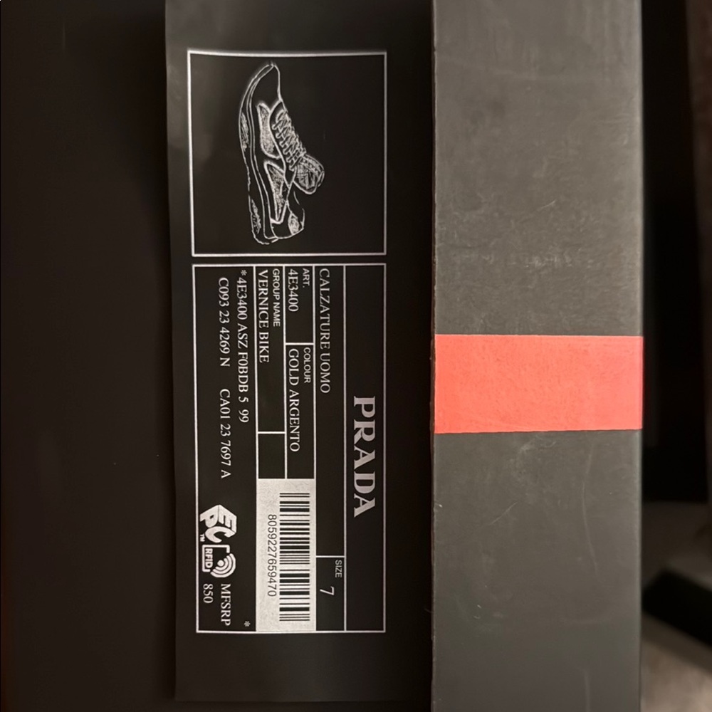Men’s Prada gold & silver sneakers.